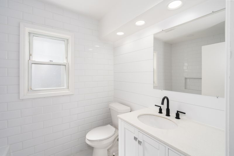 Renovated bathroom with tile flooring